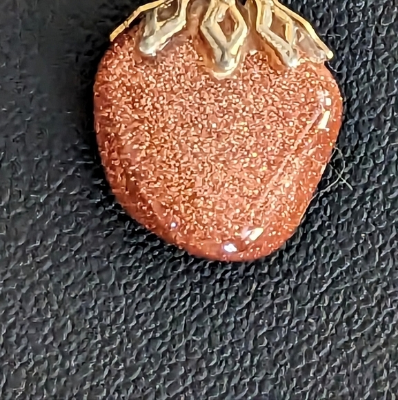 A Sunstone pendant on a Gold toned chain 19” inches. - Picture 3 of 5